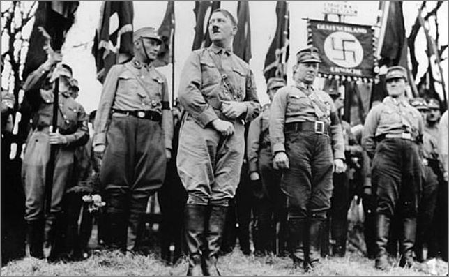 Adolf Hitler leads an SA unit in a Nazi Party parade in Weimar, 1931.